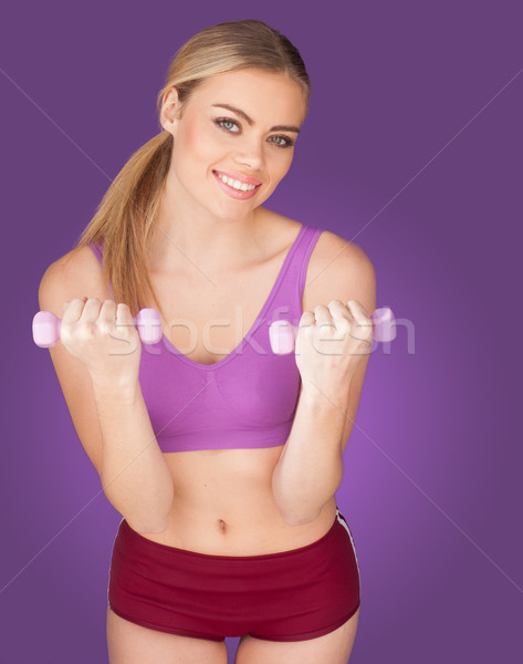 attractive woman exercising with dumbbell Stock photo © stryjek