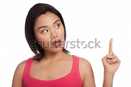 Sorprendido Asia mujer senalando jóvenes dedo Foto stock © stryjek