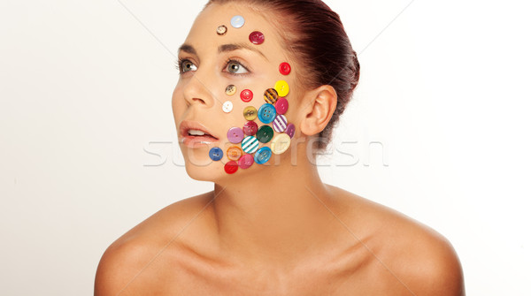 Woman with buttons on her face Stock photo © stryjek