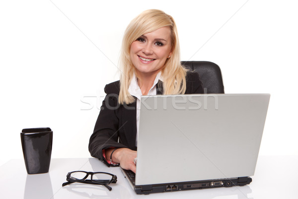 Efficient businesswoman working on her laptop Stock photo © stryjek