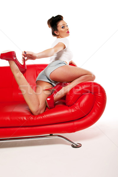 Pinup lány piros kanapé gyönyörű retro Stock fotó © stryjek