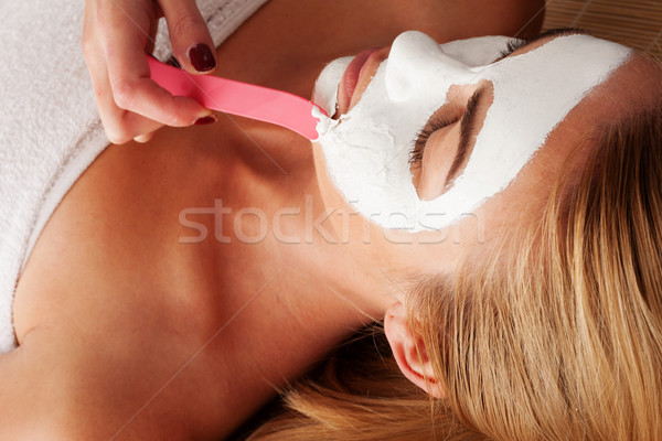 Woman having a face mask applied Stock photo © stryjek