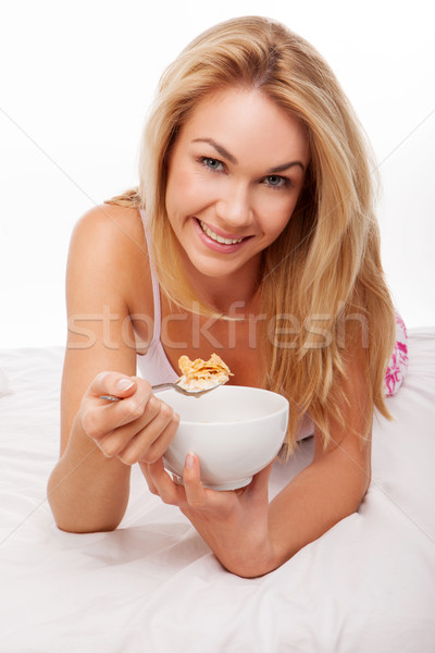 Mujer rubia cama saludable desayuno nina alimentos Foto stock © stryjek