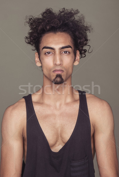Gorgeous Fit Guy with Curly Hair Against Gray Stock photo © stryjek