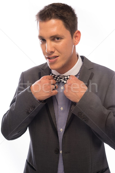 Handsome man straightening his bow tie Stock photo © stryjek