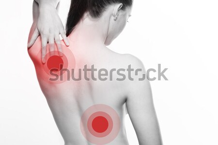 Young woman with shoulder and back pain Stock photo © stryjek