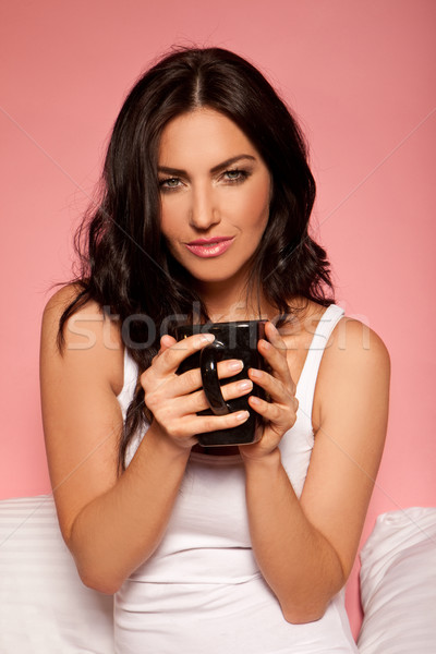 Enjoying A Cup Of Coffee In Bed Stock photo © stryjek