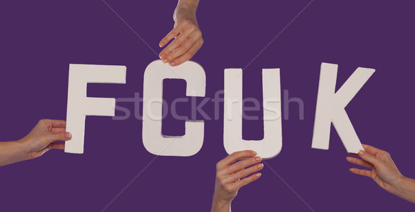 Stock photo: White alphabet lettering spelling FCUK