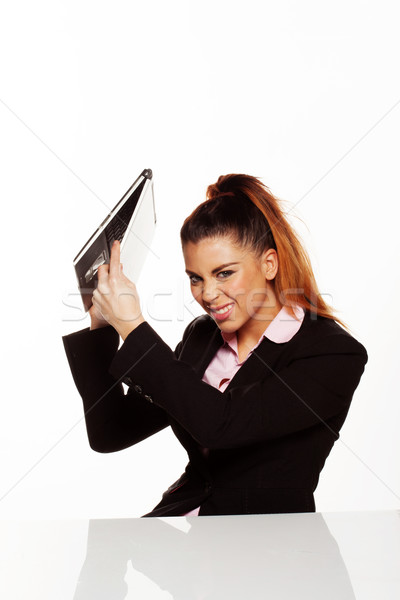 Angry businesswoman about to smash her laptop Stock photo © stryjek