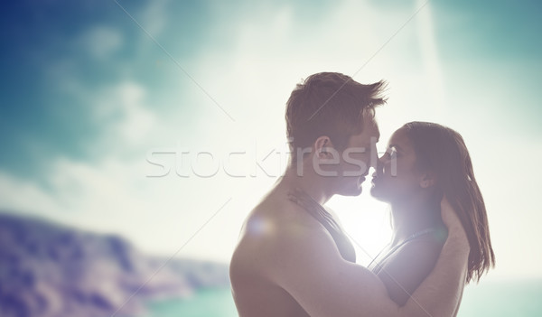 Young couple kissing backlit by the sun Stock photo © stryjek
