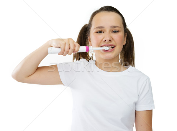 Healthy cute girl brushing her front teeth Stock photo © stryjek