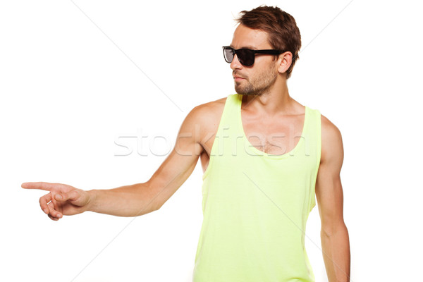 Casual man in sunglasses pointing with the hand Stock photo © stryjek