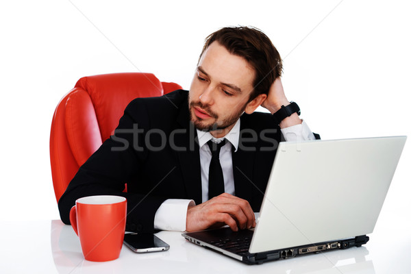 Hardworking businessman pausing to think Stock photo © stryjek