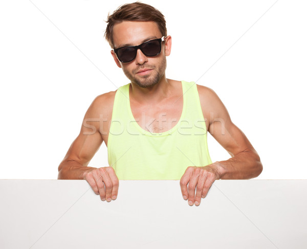 Casual man in sunglasses with a blank sign Stock photo © stryjek