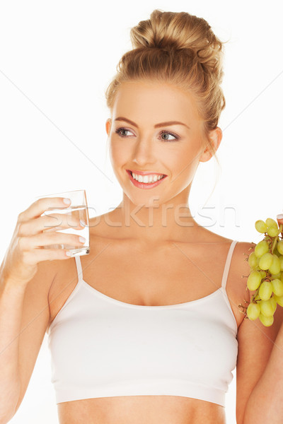 Beautiful woman holding grapes and water Stock photo © stryjek