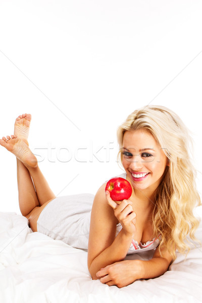 Jabłko piękna młoda kobieta czerwone jabłko bed Zdjęcia stock © stryjek