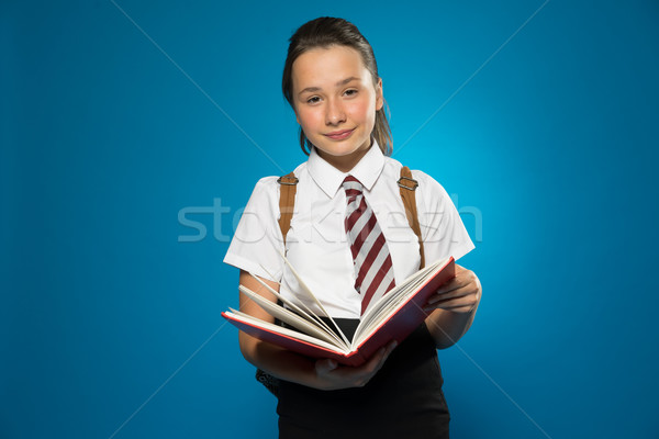 [[stock_photo]]: écolière · sourire · livre · jeunes · permanent