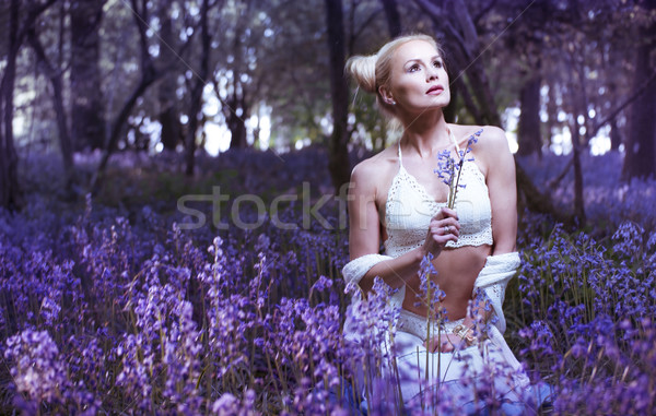 Artistic portrait of a girl in a bluebell forest Stock photo © stryjek