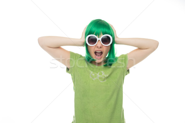 Fun young girl in a green wig and sunglasses Stock photo © stryjek