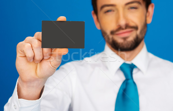 Businessman holding blank businesscard Stock photo © stryjek