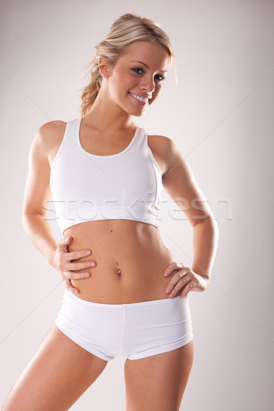 Fitness lichaam jonge mooie blonde vrouw witte Stockfoto © stryjek
