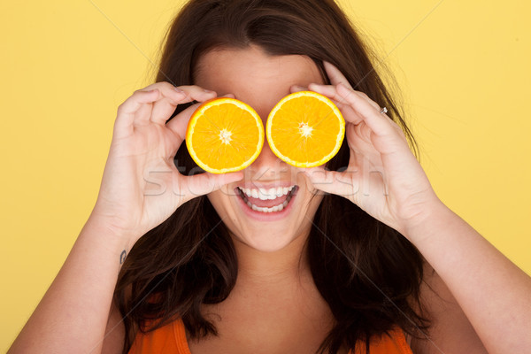 Laughing Woman With Orange Slices Over Eyes Stock photo © stryjek