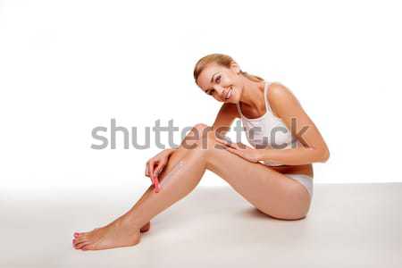 Vrouw vergadering ontharing benen mooie glimlachend Stockfoto © stryjek