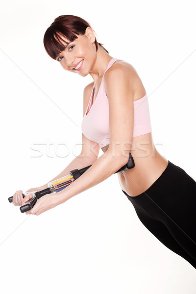 Stock photo: woman using an ab-workout equipment