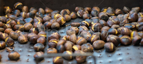 Roasted chestnuts cooling on a tray Stock photo © stryjek