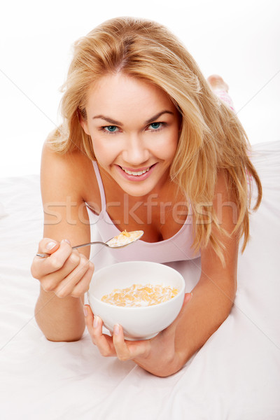Healthy woman eating breakfast cereal Stock photo © stryjek