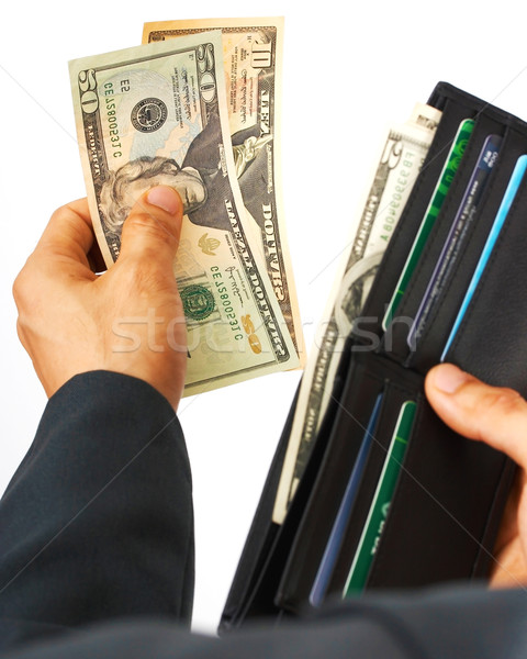 Stock photo: Man Paying A Bill In Dollars Cash