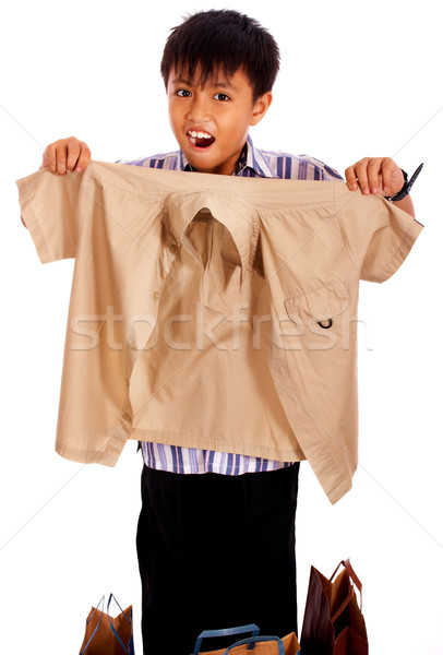 Junge heraus schauen Shirt gekauft Laden Stock foto © stuartmiles