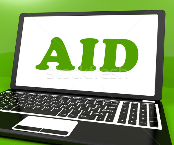 Aid On Laptop Shows Assisting Aiding Help Or Relief Stock photo © stuartmiles