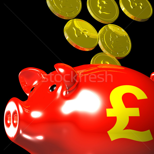 Coins Entering Piggybank Showing British Wealth Stock photo © stuartmiles