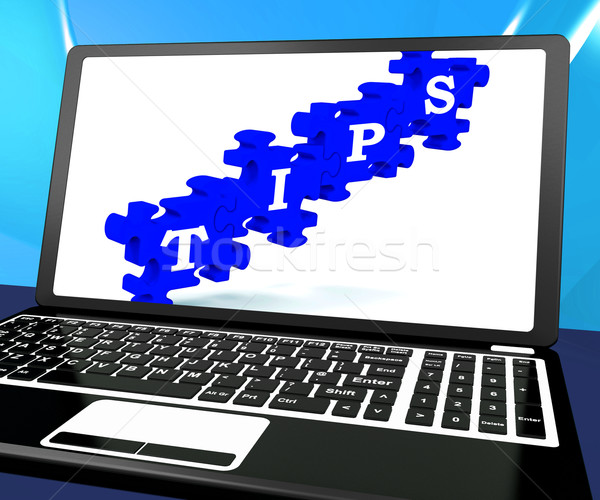 Tips Puzzle On Laptop Shows Internet Guide Stock photo © stuartmiles