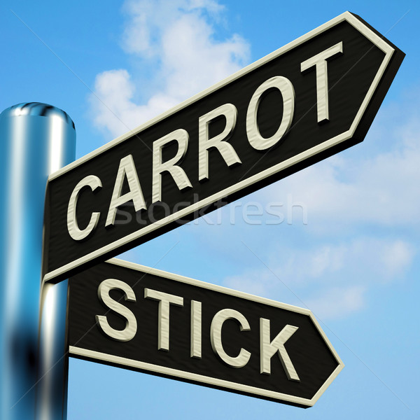 Stock photo: Carrot Or Stick Directions On A Signpost