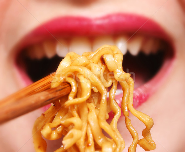 Jeunes chinois femme manger dîner [[stock_photo]] © stuartmiles