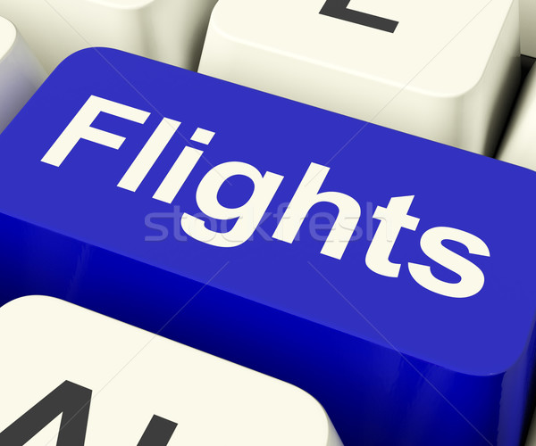 Flights Key In Blue For Overseas Vacation Or Holiday Stock photo © stuartmiles