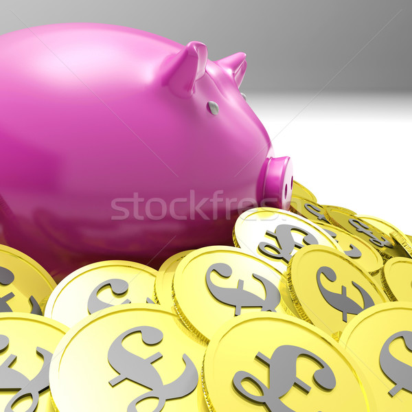 Piggybank Surrounded In Coins Shows Britain Finances Stock photo © stuartmiles