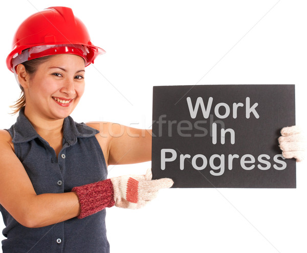 Stock photo: Work In Progress Sign Held By Construction Worker