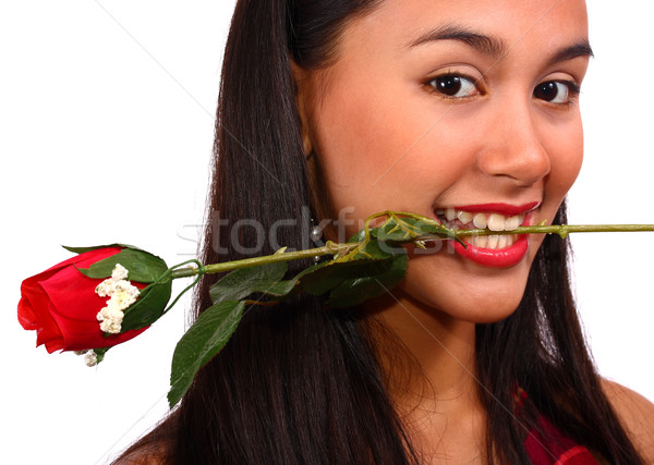 Stock photo: Girl Biting A Rose Given To Her By Her Boyfriend