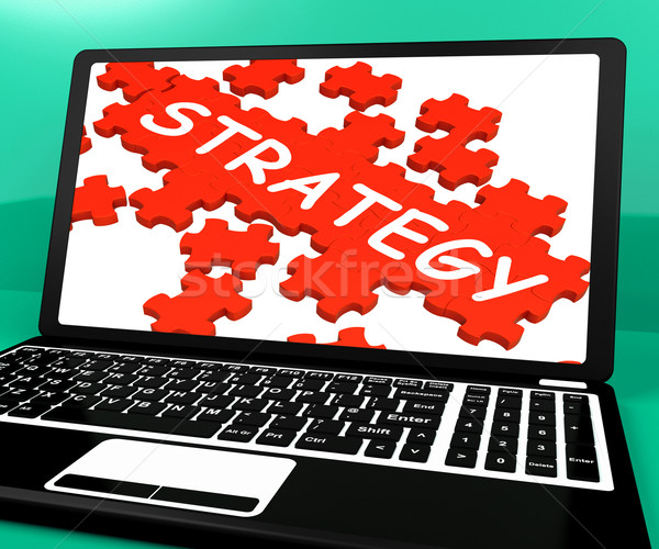 Stock photo: Strategy Puzzle On Notebook Showing Online Solutions