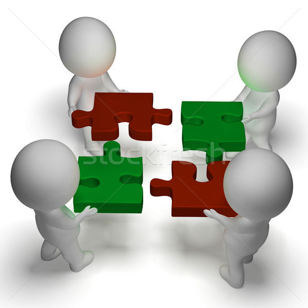 Jigsaw Pieces Being Joined Shows Teamwork And Assembling Stock photo © stuartmiles