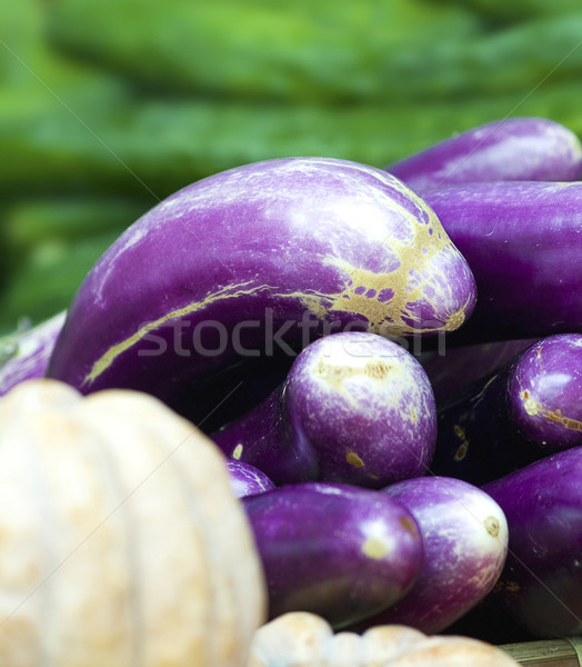 Organic eggplants and pumpkins in a market Stock photo © stuartmiles