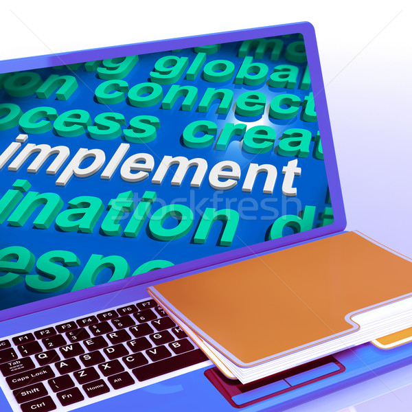 Implement Word Cloud Laptop Shows Implementing Or Execute A Plan Stock photo © stuartmiles
