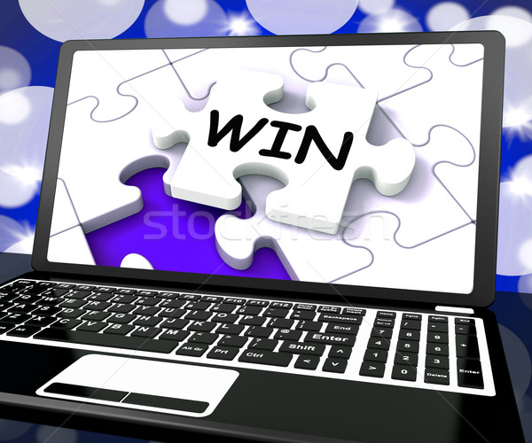 Win Puzzle On Laptop Shows Victory Stock photo © stuartmiles