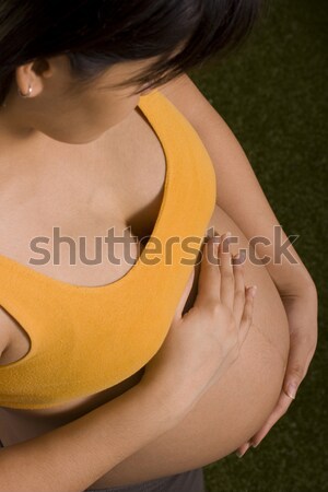 Terhes nő tart gyomor várandós anya baba boldog Stock fotó © stuartmiles