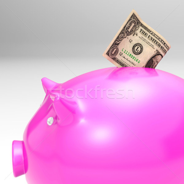 Dollar Entering Piggybank Showing Savings Stock photo © stuartmiles