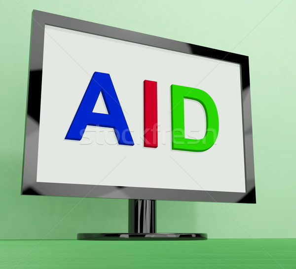 Aid On Monitor Shows Aiding Help Or Relief Stock photo © stuartmiles