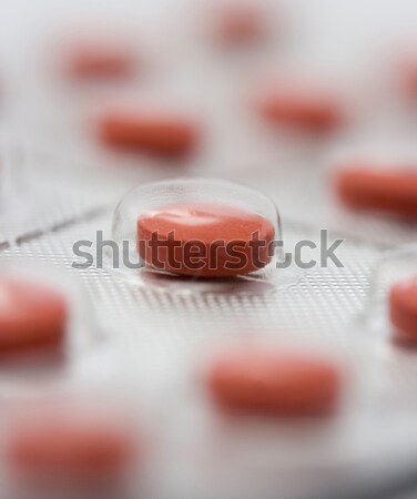 Czerwony pigułki plastikowe opakowanie choroba głowy Zdjęcia stock © stuartmiles